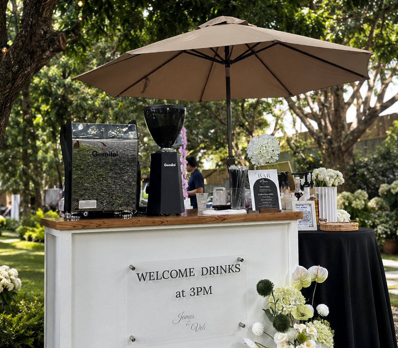 Up & At 'em coffee cart set up at an outdoor wedding